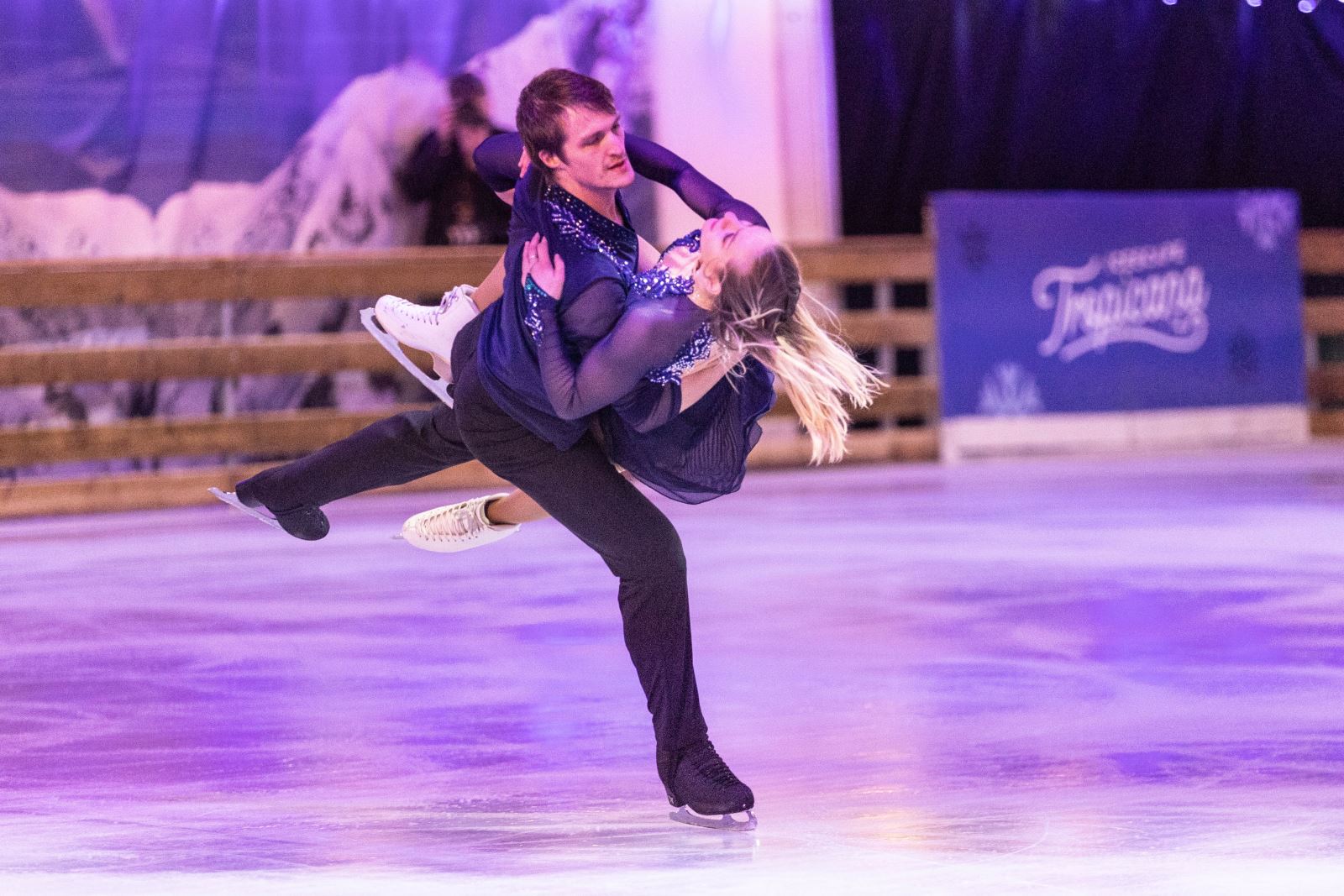 A female ice dancer being lifted by her male partner